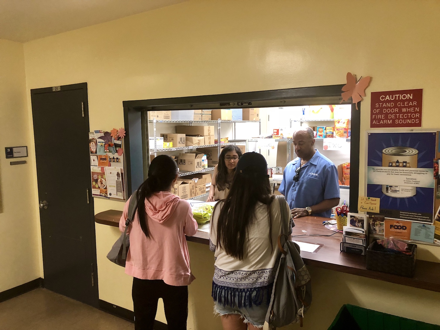 Chancellor May and LeShelle May volunteer at the Food Pantry on campus. 