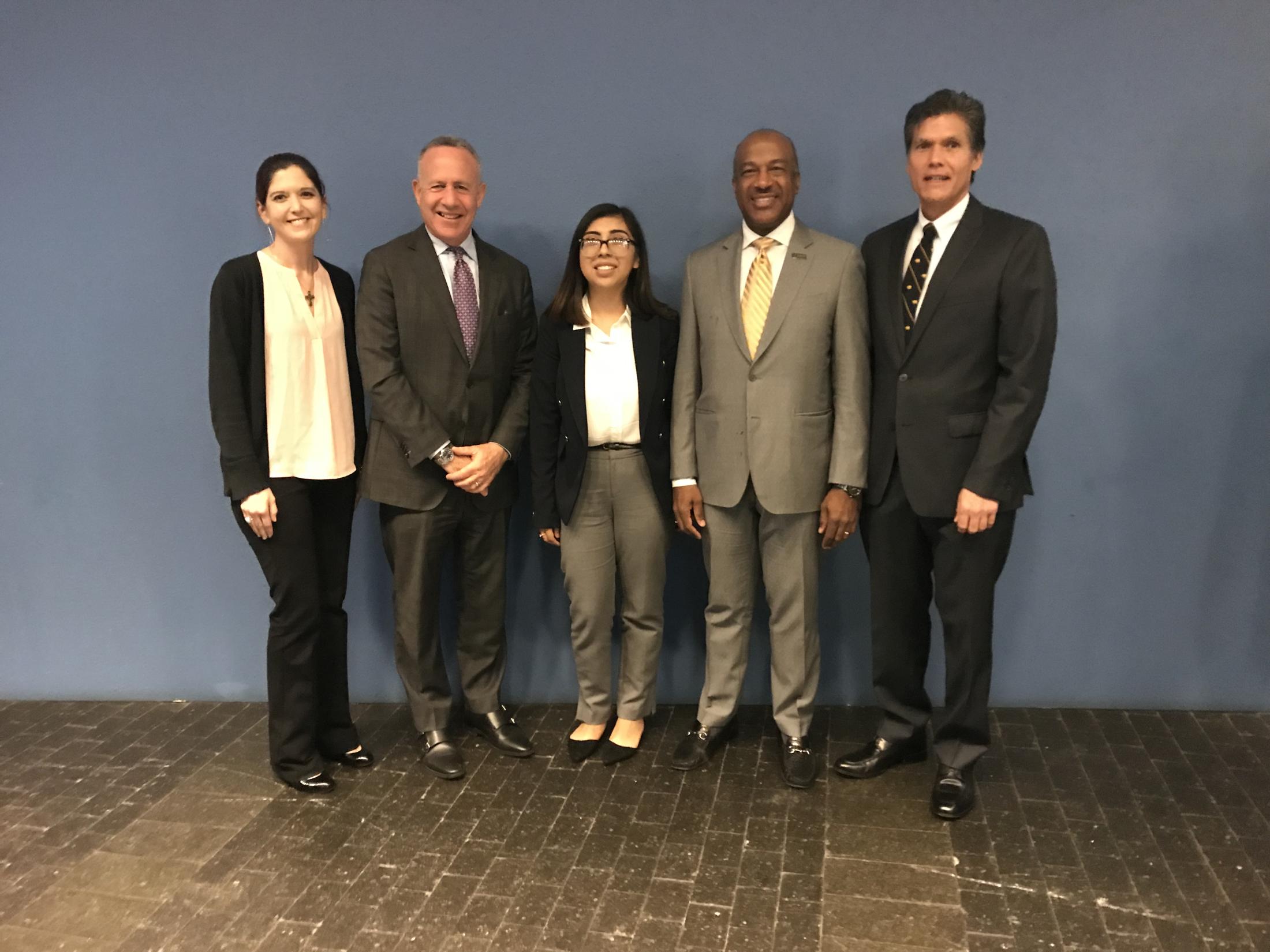 On a January panel at a UC Regents meeting, from left, were Jamie Peyton, chief of the Integrative Medicine Service at the UC Davis Veterinary Medical Teaching Hospital, Sacramento Mayor Darrell Steinberg, junior political science and sociology major Mirna Fonseca, Chancellor Gary S. May and Davis Mayor Brett Lee. (Mabel Salon/UC Davis)