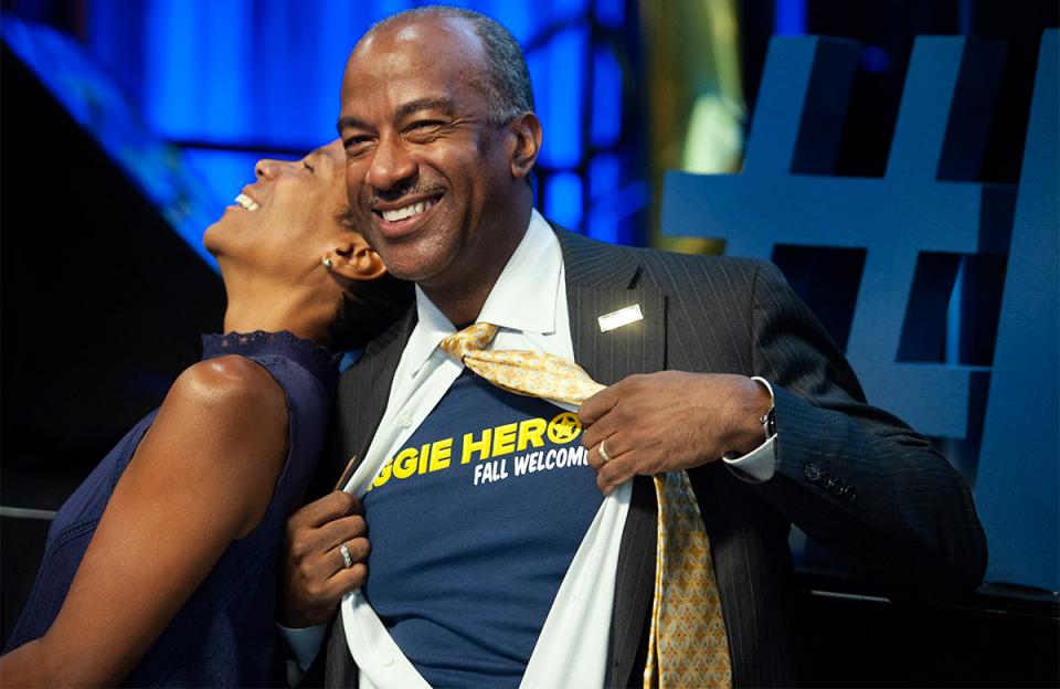 UC Davis' Chancellor Gary May channels his inner Clark Kent to show off Aggie Heroes t-shirt