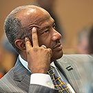 Chancellor Gary May listening intently