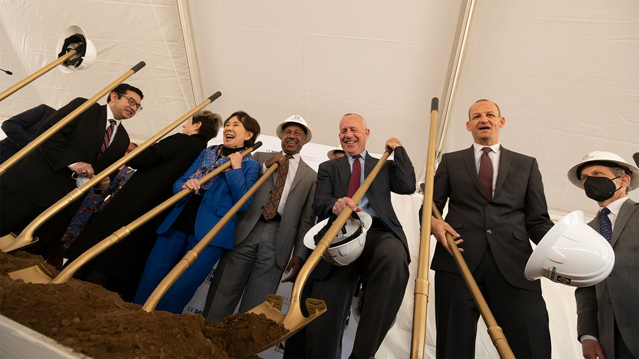 People with golden shovels break ground at Aggie Square