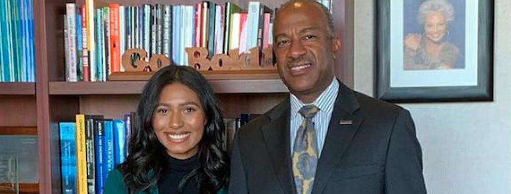 UC Davis student Tatiana Perkins poses with Chancellor Gary May