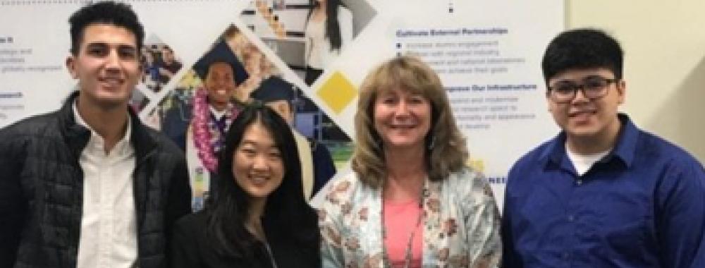 UC Davis students Mustafa Sallak, Grace Yang and Matthew Engquist pose with Dean Jennifer Curtis.
