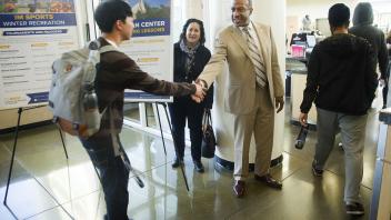 Gary May stops to talk with students while touring the ARC during his first visit to campus on Friday, February 24, 2017.