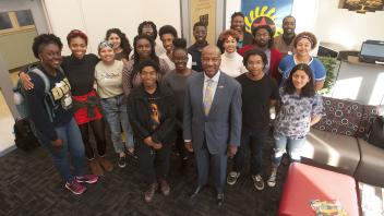 UC Davis Chancellor Gary May stand with students at the Center of African Diaspora Student Success on December 1, 2017.