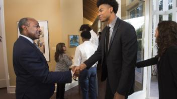 UC Davis Chancellor Designate Gary May greets student athlete Garrison Goode... Dinner at the Chancellor’s Residence