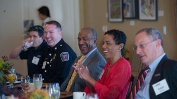 Fire Chief Nathan Trauernicht, Chancellor Gary May, LeShelle May and Provost Ralph Hexter share a laugh during the breakfast held by Chancellor Gary May and LeShelle May on February 2, 2018 at the Chancellor's Residence.