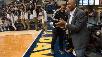 Chancellor May cheers courtside at the last home basketball game of the season. 