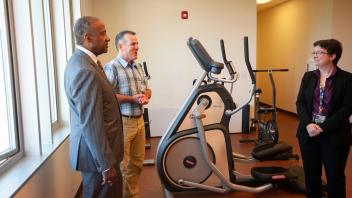 Chancellor May tours the physical therapy center at the Student Health and Wellness Center. 