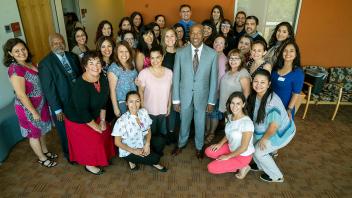 Chancellor Gary May takes a photo with the Latinx Staff and Faculty Association.