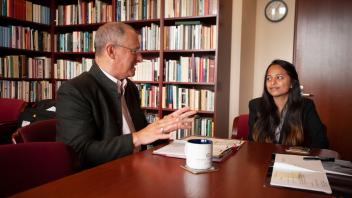 Provost Ralph Hexter talks with student shadow Namrata Kumar and the Dean of the School of Law Kevin Johnson about the level of Law School admissions with listening. Namrata, who is part of the Leadership Shadowing Program, is interested in applying to law school.