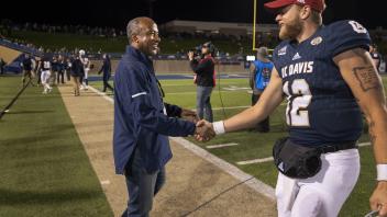 Chancellor May congratulates Quarterback Brock Johnson after the UC Davis Aggies beat Northern Iowa State 23-16 on Saturday, December 2018 at Aggie Stadium during the round two Division playoff game.