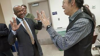 Chancellor May makes the Star Trek salute to a professor at UC Davis. 