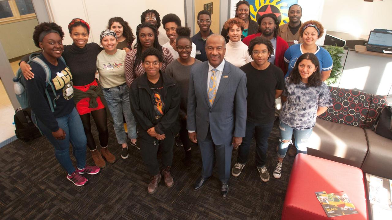 Chancellor Gary May stands with students at the Center of African Diaspora Student Success 