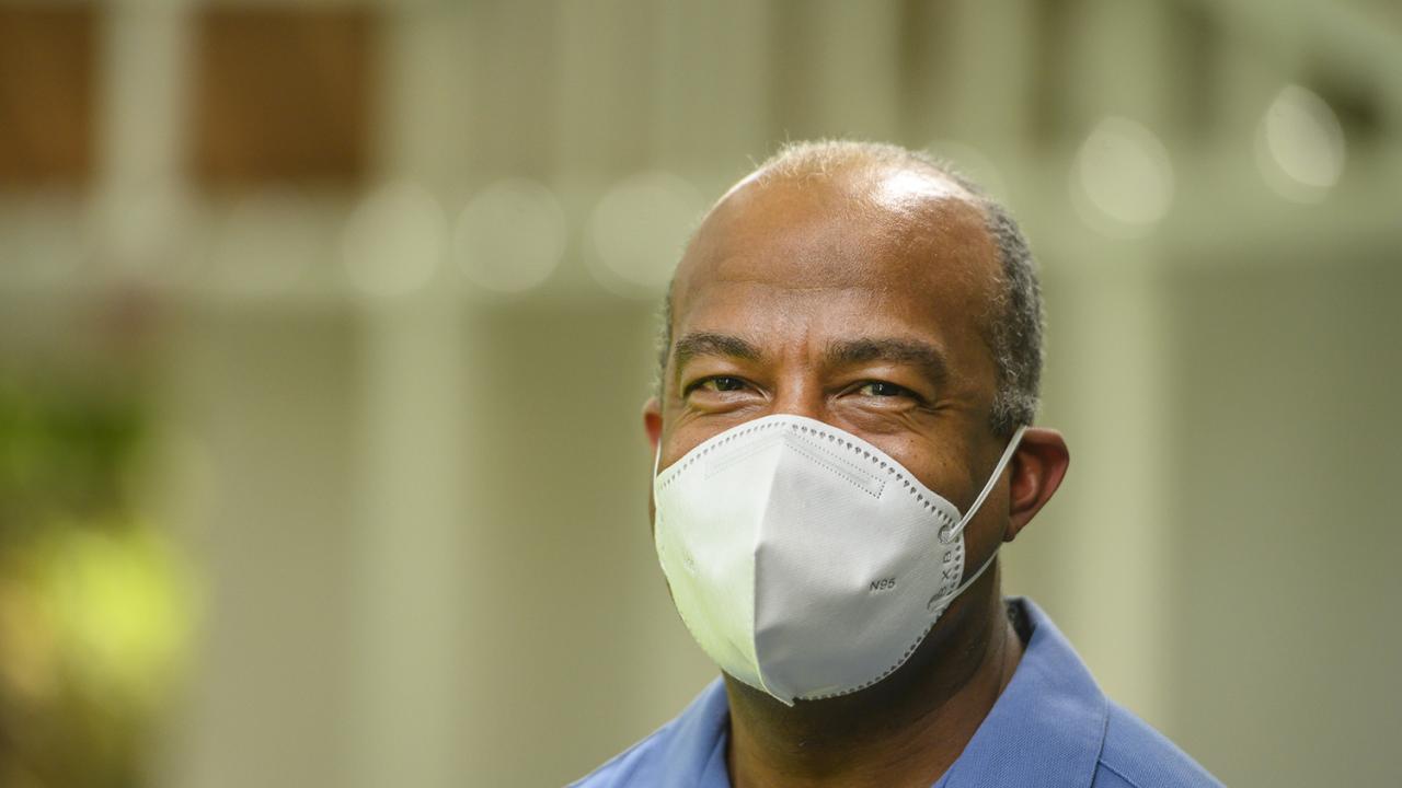 Chancellor May looking at the camera wearing a protective mask.