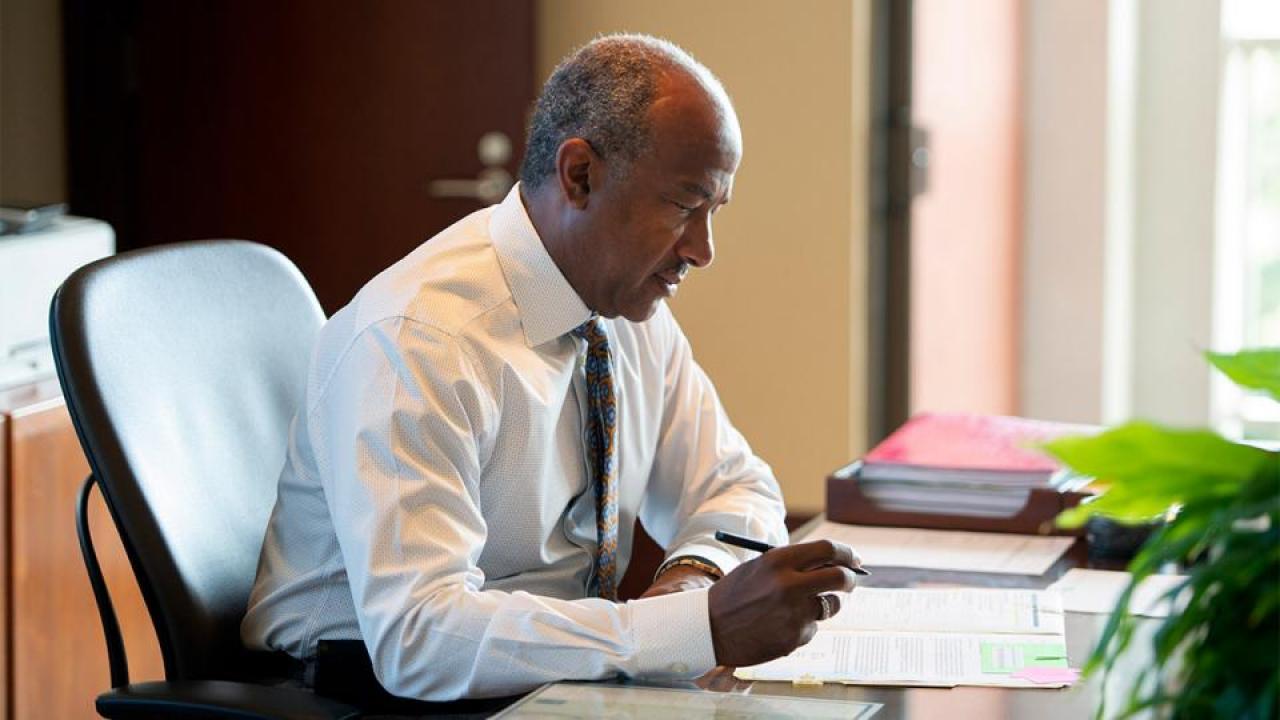 Chancellor May Writing at Desk