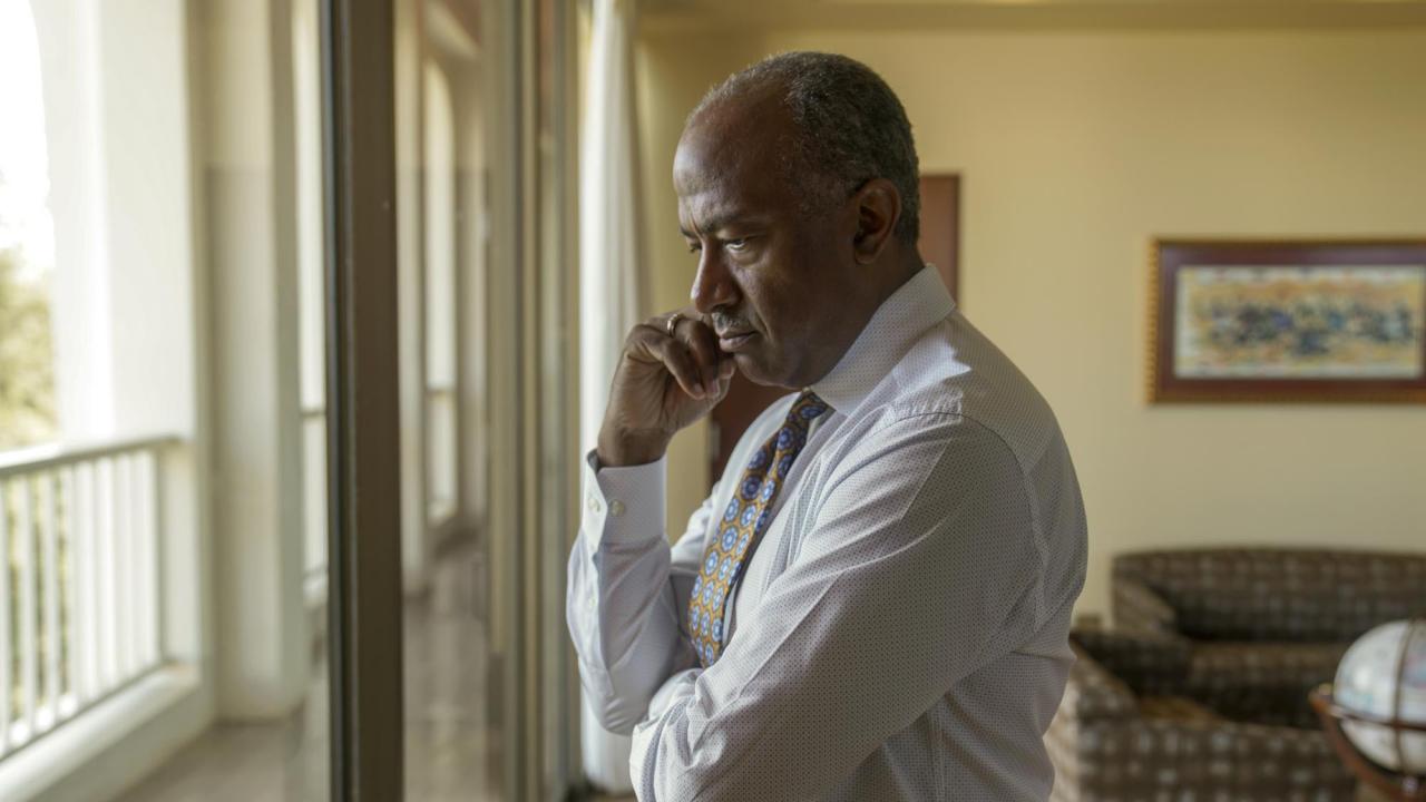 Chancellor Gary S. May, standing, serious