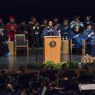 UC Davis Chancellor Gary May speaks behind a podium at his Investiture