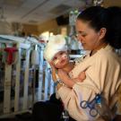 Liliya Bachinskiy holds baby Micaela, three days after the 9-month-old was successfully separated from her conjoined twin, Abigail, at UC Davis Children’s Hospital.