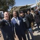 The Chancellor poses outside with a group of students at a Welcome Event in front of the Memorial Union.