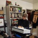 Barbara Brandon-Croft in her office surrounded by her illustrations.