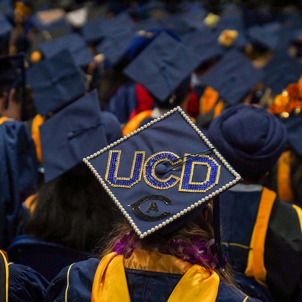 Graduation cap emblazoned with UCD at commencement 